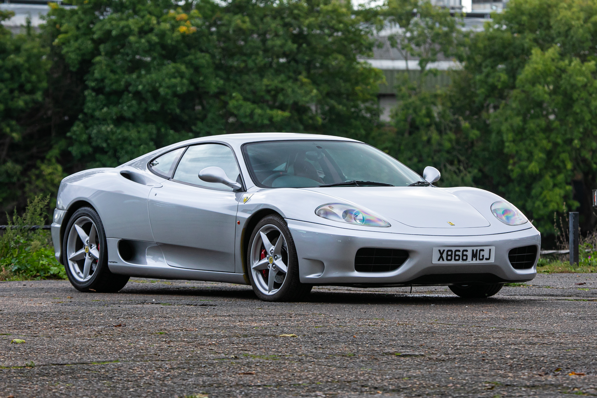 A silver ferrari 360 modena 