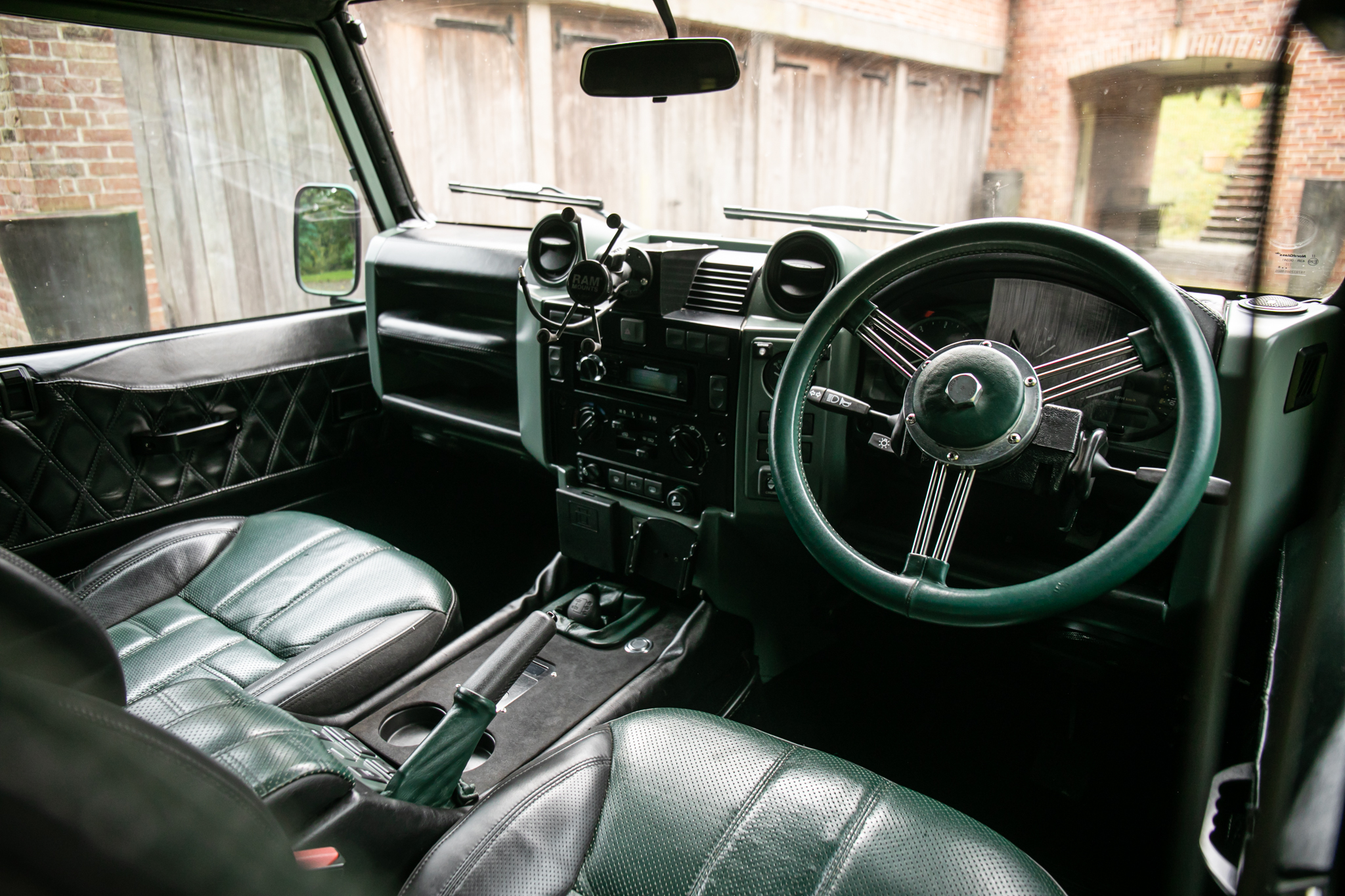 2011 Land Rover Defender Interior with green leather.